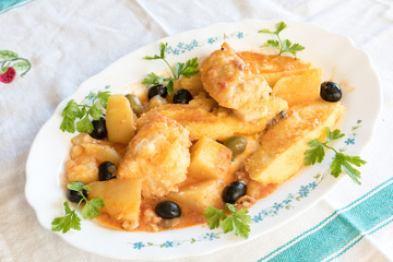 Cod with tomatoes and polenta