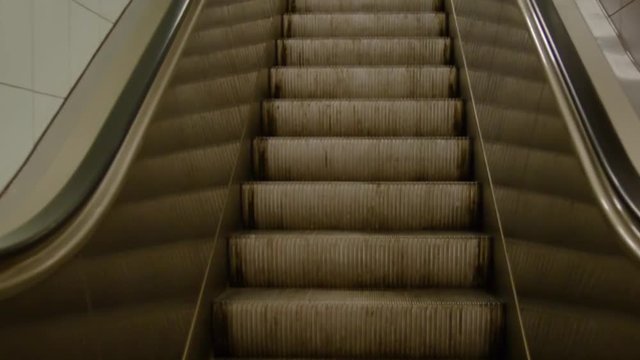 Close-up. The ladder goes up. escalator. Mesto