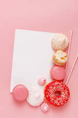 Kitchen pastry, confectionery and sweets on a pink background. Top view. Copy space.