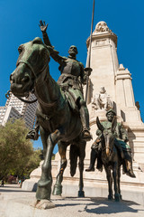 Fototapeta na wymiar Bronze sculptures of Don Quixote and Sancho Panza at the Cervantes monument, Plaza de Espana, Madrid, Spain