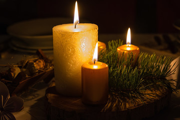 Fototapeta na wymiar Christmas wreath with burning candles