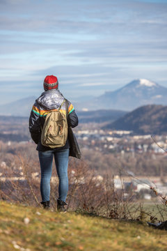 Young girl enjoys the mountain view, autumn