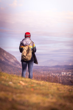Young girl enjoys the mountain view, autumn