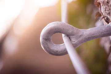 Iron piton in a rock, climbing sports