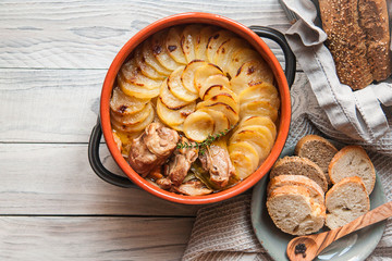 Homemade Lancashire hotpot - a stew consists of lamb, onion, carrot, Worcestershire sauce, topped with sliced potatoes, bay leaves, thyme and baked in a heavy pot on a low heat.