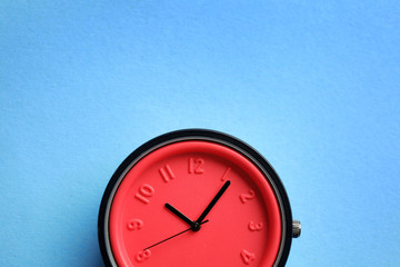 Stylish bright wrist watch on color background, top view with space for text. Fashion accessory