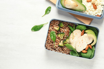 Flat lay composition with container of natural protein food on light background. Space for text