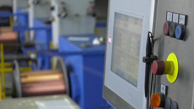 Industrial cable production. Part of production equipment. Copper wire is strung like a string. Shop drawing and stranding twist. Productions of flexible multicore cable.