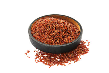 Plate with uncooked red rice on white background