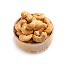 Tasty cashew nuts in bowl isolated on white