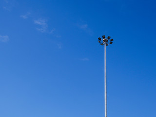 The light on the steel pole with blue sky background.