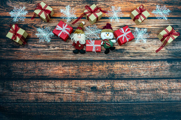 Fototapeta na wymiar Christmas Gift boxes on the dark wooden background