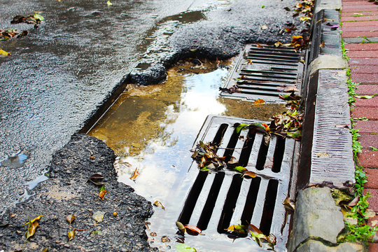 Rainwater Runoff In An Israeli City. Sewer Drain On The Road In Israel