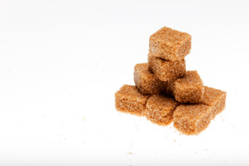 cubes of brown sugar isolated on white background