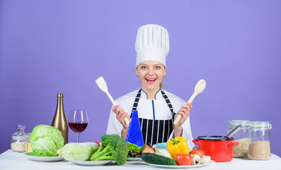 Fresh vegetables ingredients for cooking meal. Delicious recipe concept. Gourmet main dish recipes. Cooking is her hobby. Cooking healthy food. Girl in hat and apron. Woman chef cooking healthy food