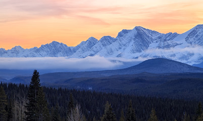 A beautiful sunset over snow covered mountains in Kananaskis in the Canadian Rocky Mountains, Alberta, Canada