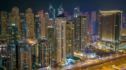 Fototapeta na wymiar Beautiful aerial top view at night timelapse of Dubai Marina in Dubai, UAE