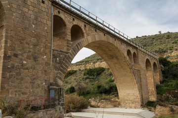 Fototapeta na wymiar old bridge across the river, province of almeria, region of andalucia, spain
