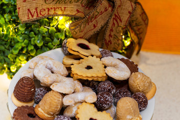 Christmas cookies, ribbon on green christmas sphere.