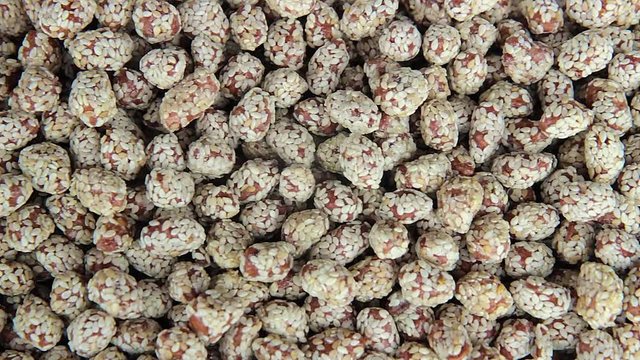 Nuts are glazed with a sesame seeds