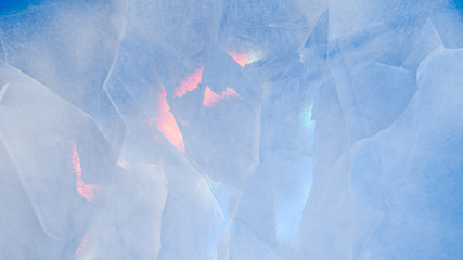 Ice texture with colorful iridescent multi-colored reflections