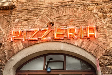 Wandaufkleber Retro signboard Pizzeria in old italian city © EdNurg