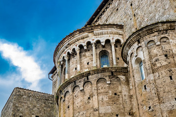 Fototapeta premium Closeup of the apses of the Cathedral Basilica of Santa Maria Annunziata, in Piazza Innocenzo III. Stone buildings from the Middle Ages. Anagni, Frosinone, Italy.