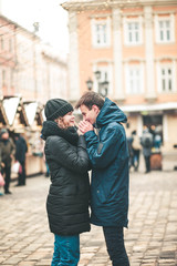 Young loving couple for the christmas street