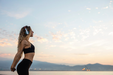 Woman doing sport at dawn