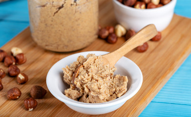 Hazelnut butter on wooden background