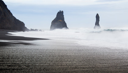 Fototapeta na wymiar Reynisdrangar sea stacks on Reynisfjara black sand beach near Vik, Iceland