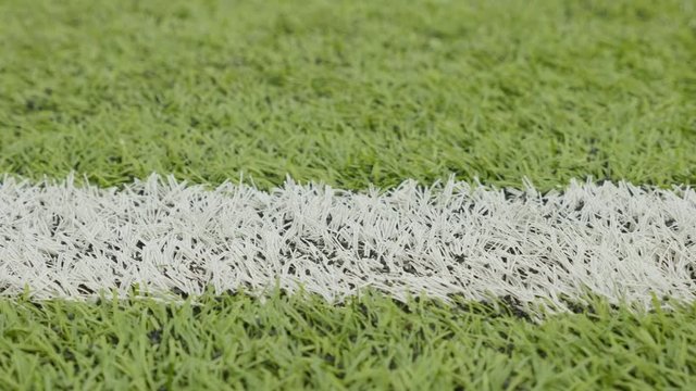 White line of the soccer field. Close-up horizontal slider shot