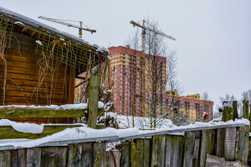 Winter sketches. Fluffy snow on houses, fences and other buildings.