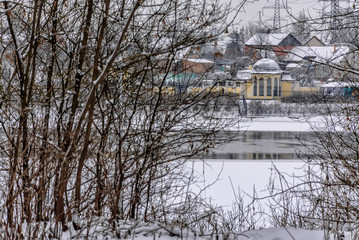 Winter sketches. Fluffy snow on houses, fences and other buildings.