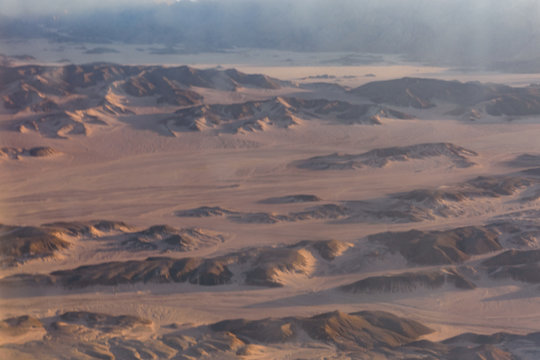 Aerial view on arabian desert and Red sea mountains from the airplane