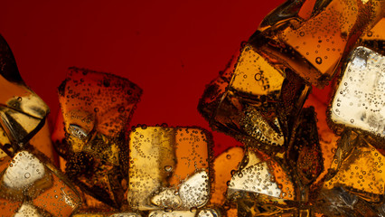 Close up view of the ice cubes in cola