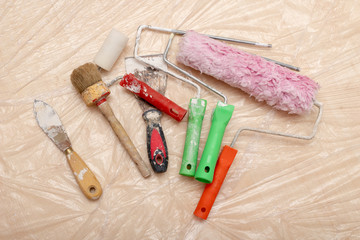 Paint roller, brush and other accessories. Renovation and painting of walls in the apartment.