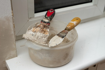 Applying putty to the wall in a new apartment. Renovation and painting of walls at home.