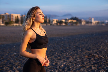 Woman doing sport at dawn