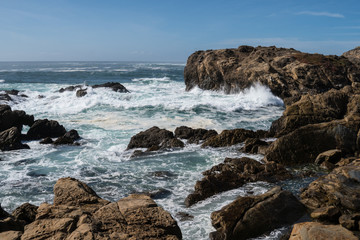 Fototapeta na wymiar Scenic ocean view of Point Lobos State Reserve in California, near Monterey along the Pacific Coast Highway, as waves crash into the shoreline