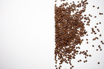 Fototapeta premium Aerial view of coffee beans half white with copy space