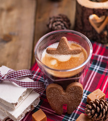 Fresh aromatic coffee and Italian Christmas sweets. Nougat with almonds, karemelnye sweets, ginger cookies and hot drink. Candles and holiday decorations. Free space for text.