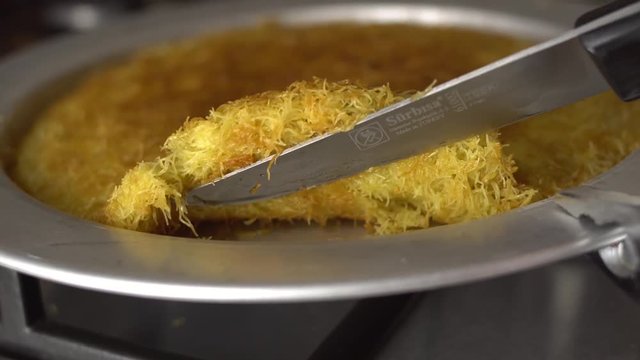 delicious dessert named KUNEFE or KUNEFAH. Cheese dessert from middle east kitchen, Turkey/Arabia/Palestine cuisine