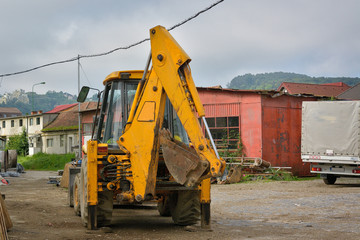Yellow excavator on a construction site