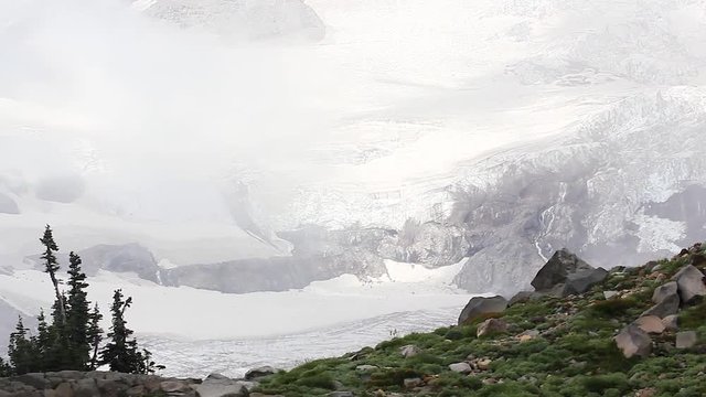 frozen white and blue ice glacier on mount rainier