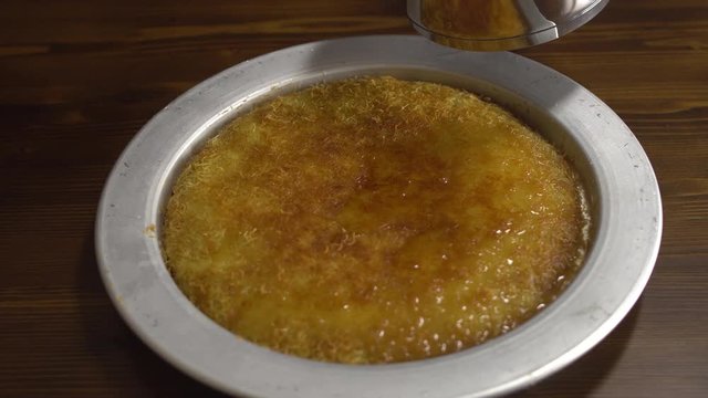 delicious dessert named KUNEFE or KUNEFAH. Cheese dessert from middle east kitchen, Turkey/Arabia/Palestine cuisine. 
