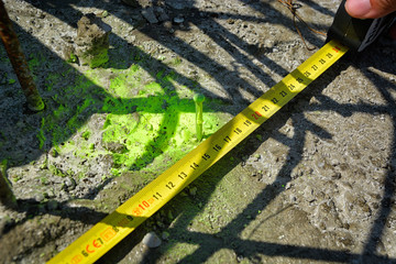 Geodetic survey mark set in concrete . ground marker