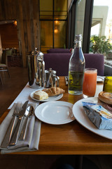 Delicious Breakfast Table Setting with Juice and Scones