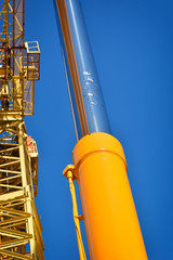 Part of yellow construction tower crane