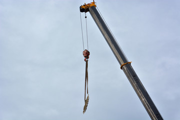 Boom of mobile crane with blue sky background